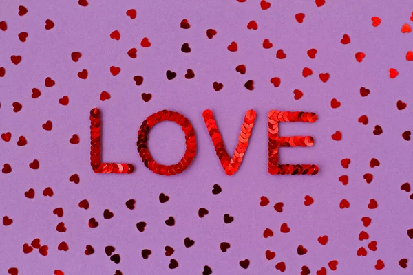 Inscription Love Embroidered Red Sequins Purple Background Scattered Random Sequins — Stock Photo, Image