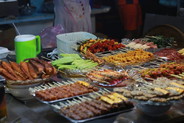 grilled dishes like pork, okra, beef, bell pepper in ho thi ky street food