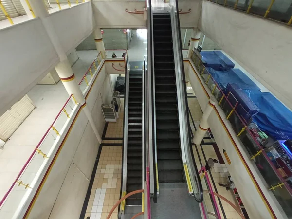 Escalator in a closed mall building