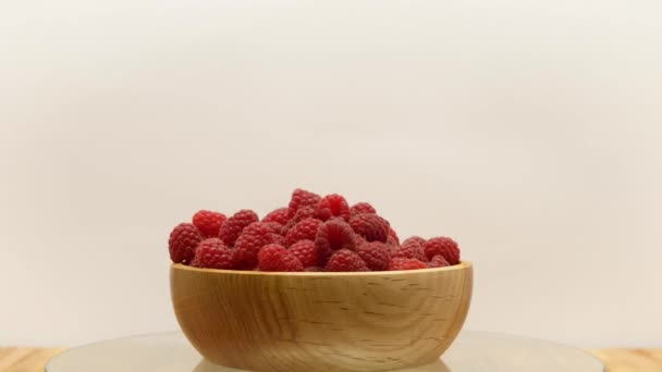 Rotating Fresh Ripe Raspberries Wooden Bowl White Background — Vídeos de Stock