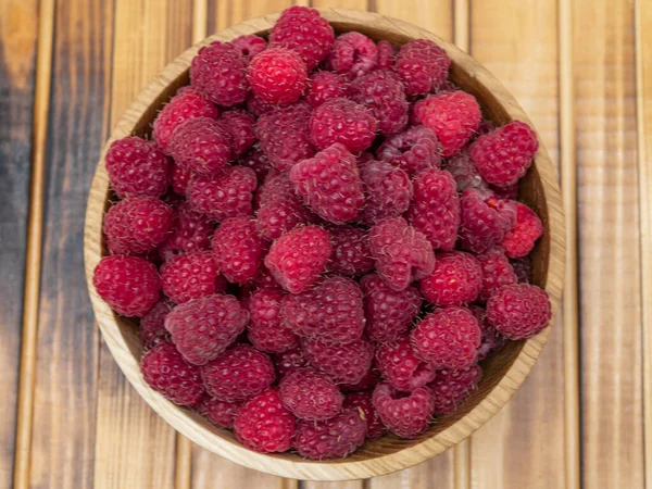 Fresh Raspberries Wooden Bowl Wooden Background Top View — Stock Fotó