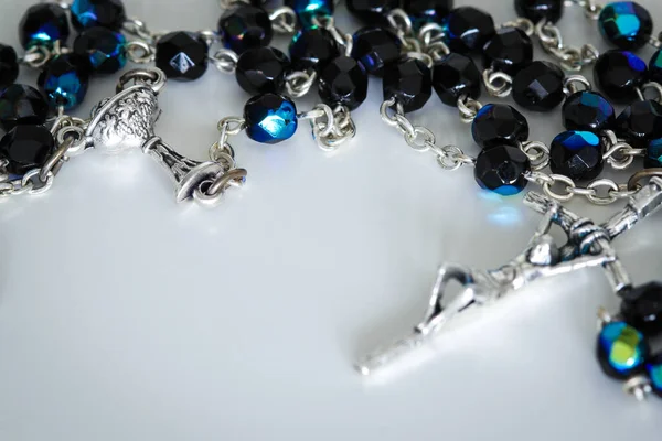 Close Rosary Lying White Table Focus Grail — Stock Photo, Image