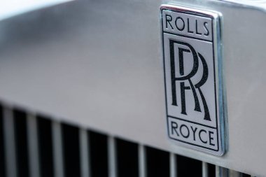 Brand logo on radiator grille of classic luxury car Rolls Royce