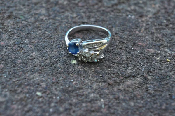 ring with diamond on a stone background