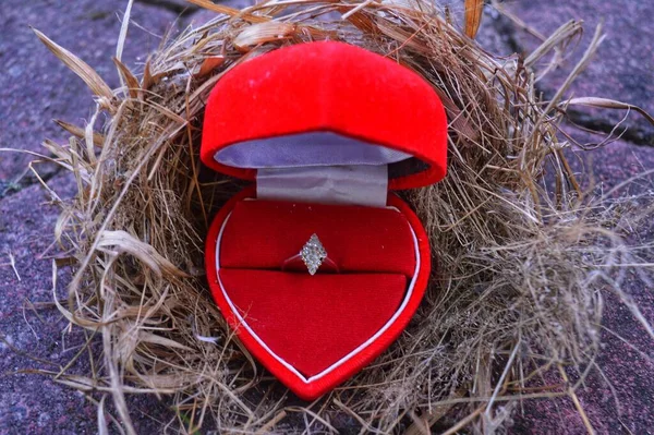 red wedding ring with heart shaped