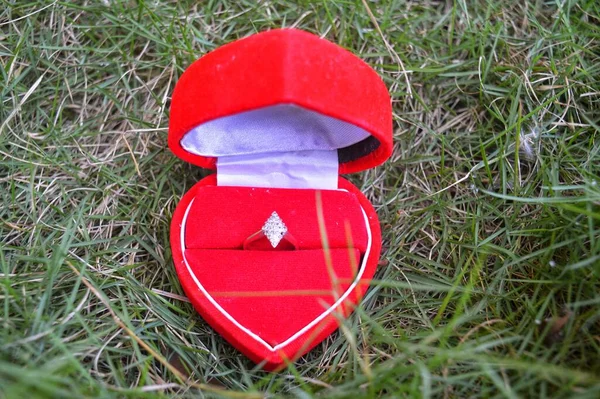 red heart shaped toy car with a bow