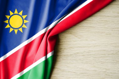 Namibya bayrağı. Namibya 'nın kumaş desenli bayrağı. 3 boyutlu illüstrasyon. metin için arka boşluk ile. Yakın çekim görünümü.