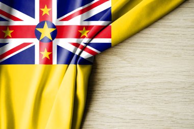 Niue bayrağı. Niue 'nun kumaş desenli bayrağı. 3 boyutlu illüstrasyon. metin için arka boşluk ile. Yakın çekim görünümü.