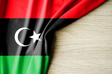 Libya bayrağı. Libya 'nın kumaş desenli bayrağı. 3 boyutlu illüstrasyon. metin için arka boşluk ile. Yakın çekim görünümü.