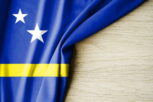 Curacao bayrağı. Curacao 'nun kumaş desenli bayrağı. 3 boyutlu illüstrasyon. metin için arka boşluk ile. Yakın çekim görünümü.