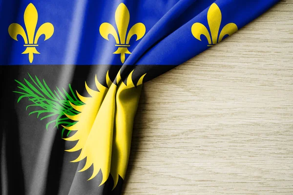 Guadeloupe bayrağı. Guadeloupe 'un kumaş desenli bayrağı. 3 boyutlu illüstrasyon. metin için arka boşluk ile. Yakın çekim görünümü.