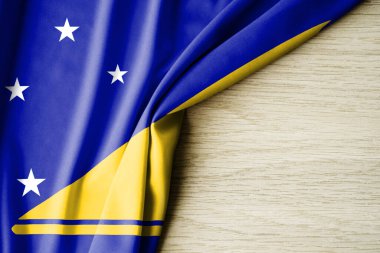 Tokelau bayrağı. Tokelau 'nun kumaş desenli bayrağı. 3 boyutlu illüstrasyon. metin için arka boşluk ile. Yakın çekim görünümü.
