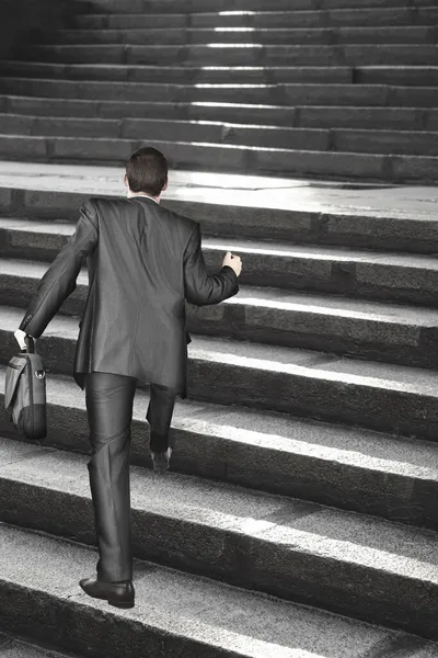 Rear View Male Manager Carrying Suitcase While Walking Upward Stairs — Stock Photo, Image