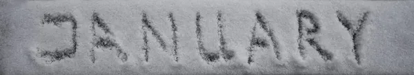 という言葉は雪に覆われたボードの背景に書かれています — ストック写真