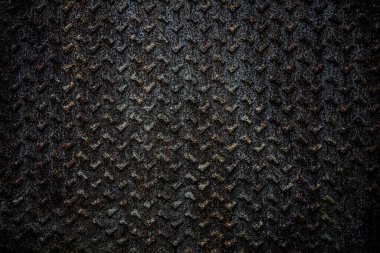 Eski, pürüzsüz, elmas kaplama desenli kahverengi, paslı, eski tarz bir arka plan. Pas demiri. Elmas desenli metal tabaka. çelik yüzey