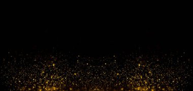 Siyah arka planda altın parıldayan sihirli altın tozu. Koyu arkaplan üzerindeki parçacıklar
