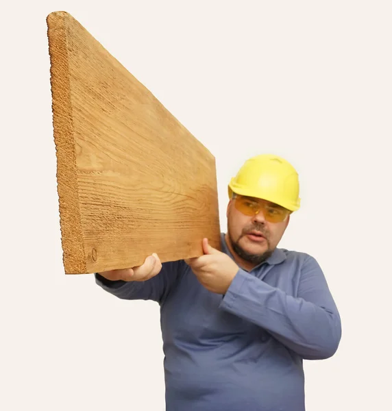 Constructor Hombre Amarillo Sostiene Tablero Con Dos Manos Aislado Sobre —  Fotos de Stock