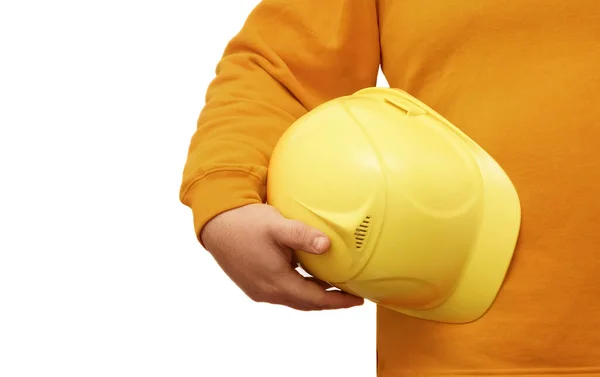 在孤立的背景下手持黄色头盔的工人或工程师 没有脸 — 图库照片