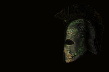 roman helmet isolated on a black background. 
