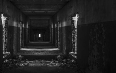 Abandoned corridor in dark industrial building. Creepy corridor. Mystical empty tunnel in abandoned house in perspective. 