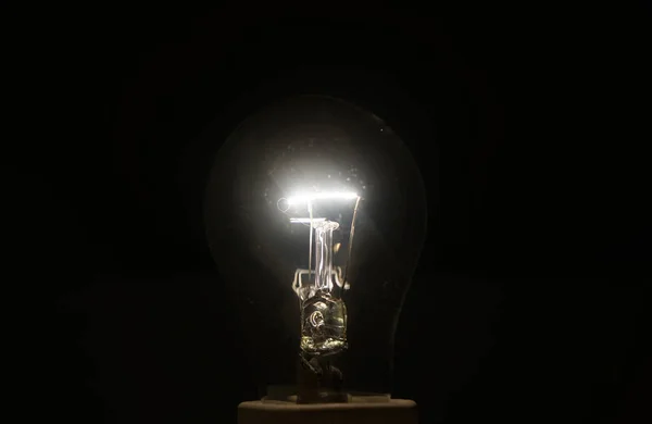 Glowing Yellow Light Bulb Inspiration Concept One Light Bulb Isolated — стоковое фото