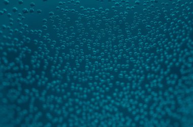 Water drops on glass, rain drop. Abstract background - of rain water droplets on reflective mirror surface with selective focus - black color. Bubbles with oxygen of mineral water