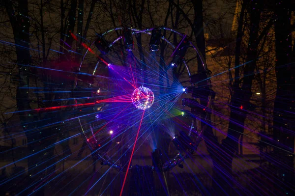Vilnius, Lithuania - January 28, 2022: Disco ball reflects Lazer lights in the Park at Vilnius Light Festival — Stock Photo, Image