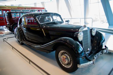 Stuttgart, Germany - July 5 2022: Historic collection of Mercedes racing cars and other brand in Mercedes-Benz Welt museum. Presentation of roadsters, AMG, silver arrows and 300 SL with gullwing doors