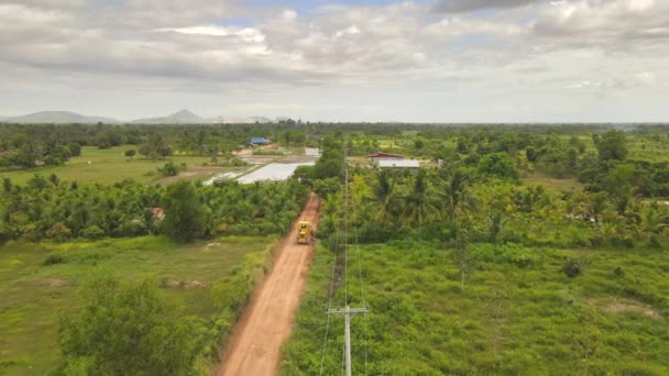 Aerial Drone Footage Road Grader Widening Side Rural Road Countryside — Vídeos de Stock