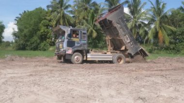 Kampot  - Cambodia - 07 -09- 2021 :  Small truck stucks in the hole while  it loading earth in preparation for the construction and expansion of housing