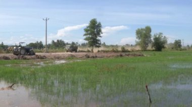 View of a small truck loading earth in preparation for the construction and expansion of housing