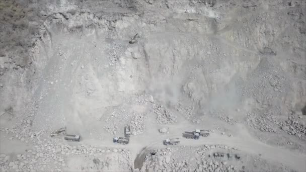 Backward Aerial Drone Footage Excavators Mucking Out Broken Rocks Mountain — Stockvideo