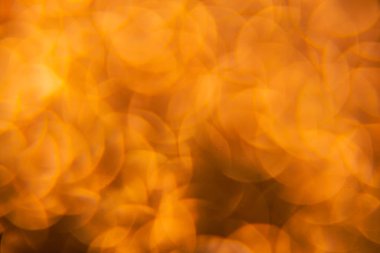 Oval sarı nesnelerden yapılmış doku. Etki, simli yüzeyi odaklanmadan makro ölçekte fotoğraflayarak elde edildi..