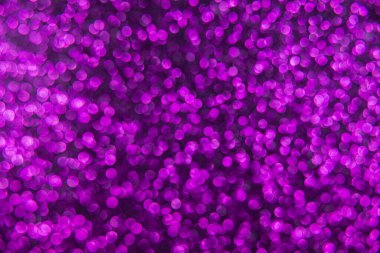 Doku oval mor nesnelerden yaratıldı. Etki, simli yüzeyi odaklanmadan makro ölçekte fotoğraflayarak elde edildi..