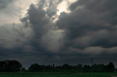 Black, heavy, undulating storm clouds. They are awe-inspiring, foreshadowing the arrival of sudden rains and life-threatening winds.
