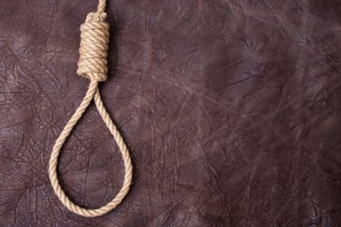 Kahverengi desenli deri arka planda Celladın düğümü