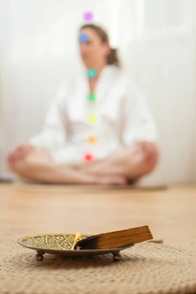 Blurred Woman White Satin Meditating Lotus Pose Glowing Chakras Burning — Stockfoto