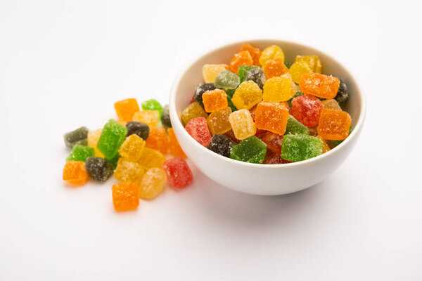 Indian colorful candy and jelly bites sweet, fruit flavoured confectionery coated with sugar, served in a plate or bowl