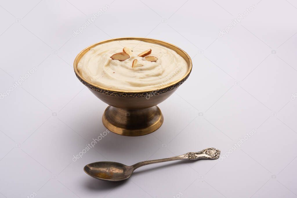 Shrikhand is an Indian sweet dish made of strained yogurt, garnished with dry fruits