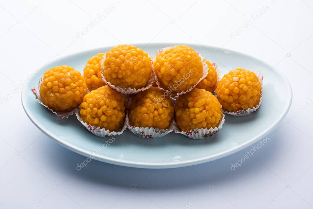 indian sweet moticho or laddoo or Bundi laddu made of gram flour very small balls or boondis which are deep fried and soaked in sugar syrup before making balls