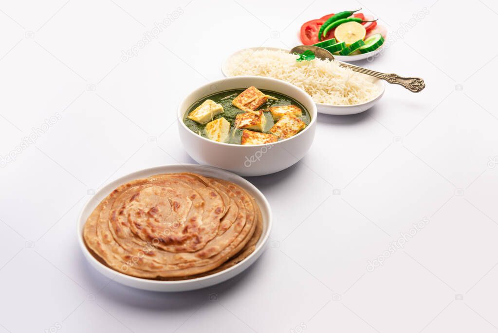 Palak paneer or Spinach and Cottage cheese curry served with rice and chapati