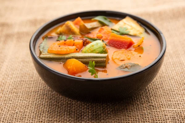 Sambar is a lentil-based vegetable stew/soup, cooked with pigeon pea and tamarind broth. It is popular in South Indian and Sri Lankan cuisines.