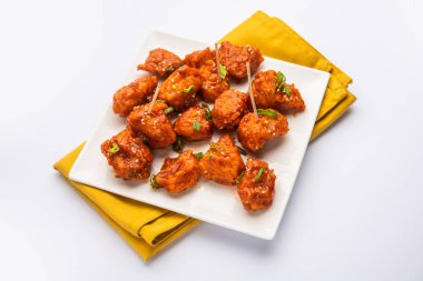 Biberli tavuk kurutma Hakka Çin mirasının popüler bir Hint-Çin yemeği türüdür.