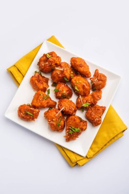 Biberli tavuk kurutma Hakka Çin mirasının popüler bir Hint-Çin yemeği türüdür.