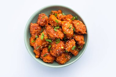 Biberli tavuk kurutma Hakka Çin mirasının popüler bir Hint-Çin yemeği türüdür.