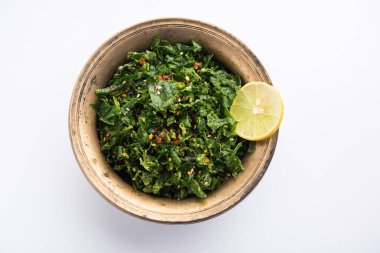 Çatırdayan ıspanak ya da çıtır çıtır Palak, limon dilimli bir kâse veya tabakta servis edilen Hint marşıdır.