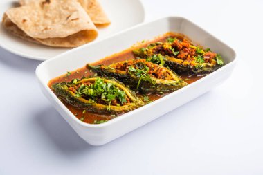 Bharwa Karela masala or stuffed bitter melon curry recipe