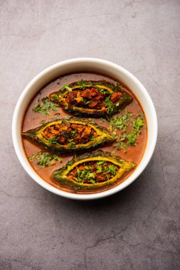 Bharwa Karela masala or stuffed bitter melon curry recipe