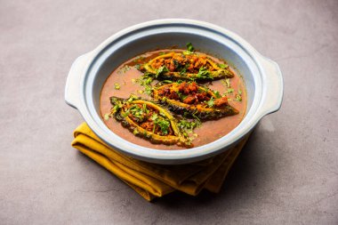 Bharwa Karela masala or stuffed bitter melon curry recipe
