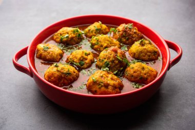 Veg Kofta Curry is an exotic Indian gravy dish made from mix vegetable dumplings dunked in a onion-tomato based gravy